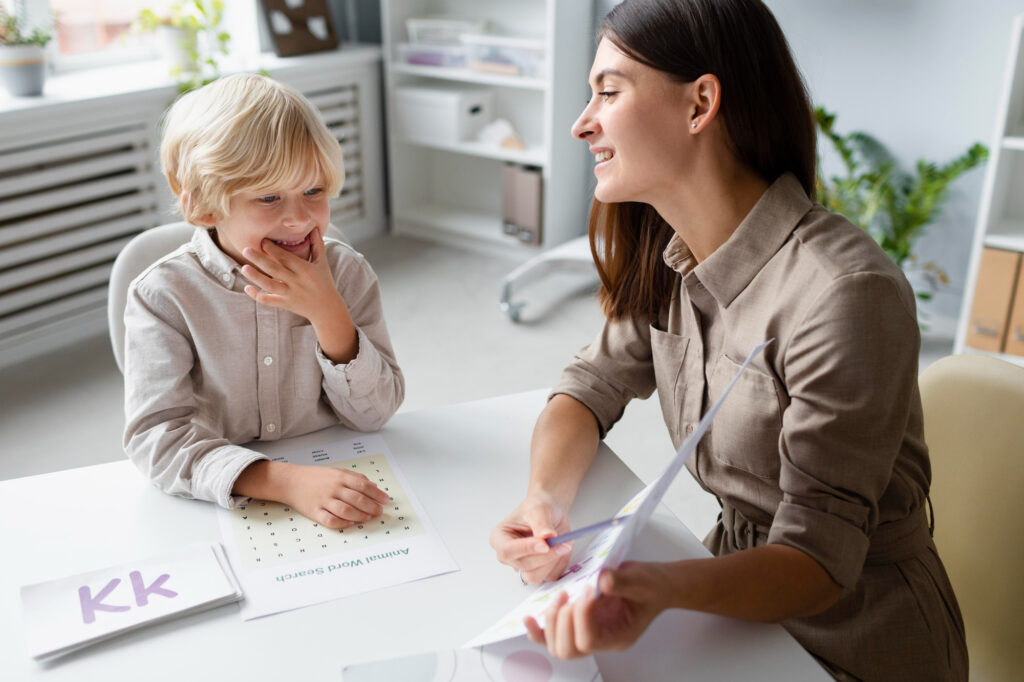 Behavior therapist supporting a student in a classroom alongside the teacher