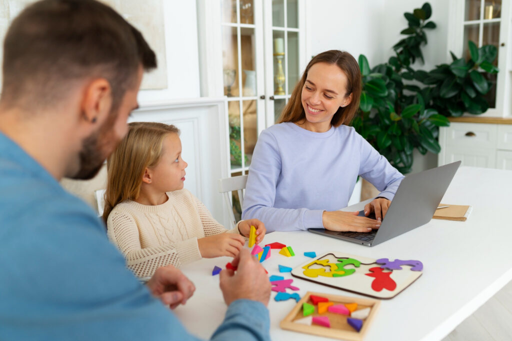 BCBA coaching a parent through at-home ABA strategies with their child